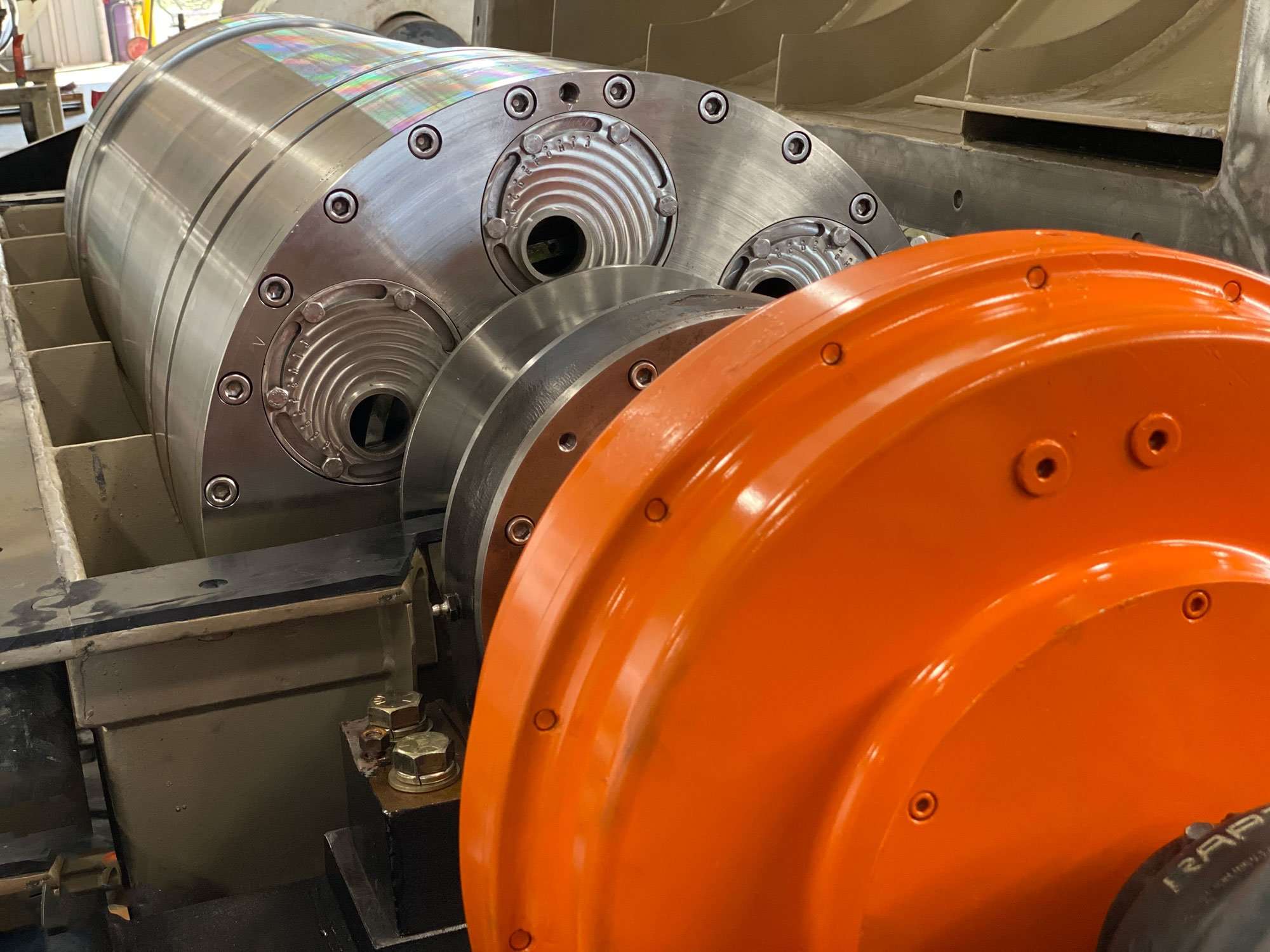 Large industrial decanter centrifuge staged for repair evaluation at a Centrifuge World service center